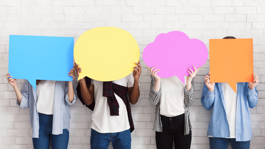 Sharing ideas. Teens holding empty speech bubbles